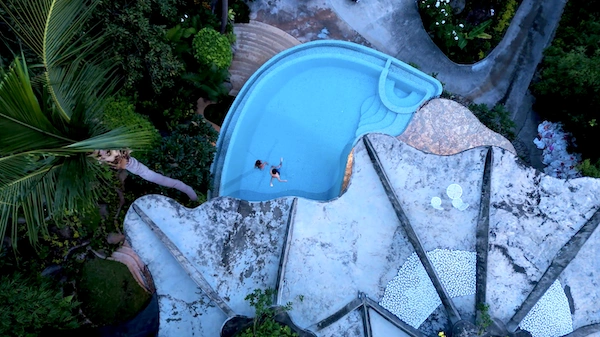 Luxury Resort Kids Jumping Into Infinity Edge Pool - The Orchid Villa at Monkey Flower Villas Koh Tao